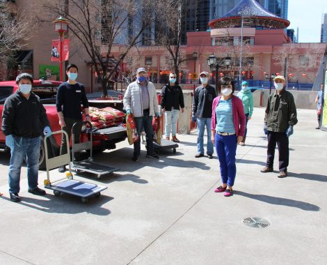 ACCESS, CCLC, and CCCSA volunteers standing distanced in Chinatown
